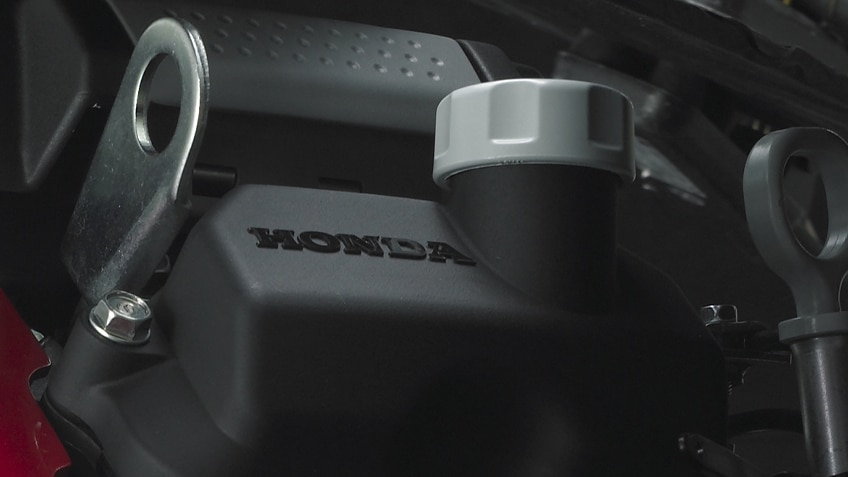 Close up of Honda logo on engine